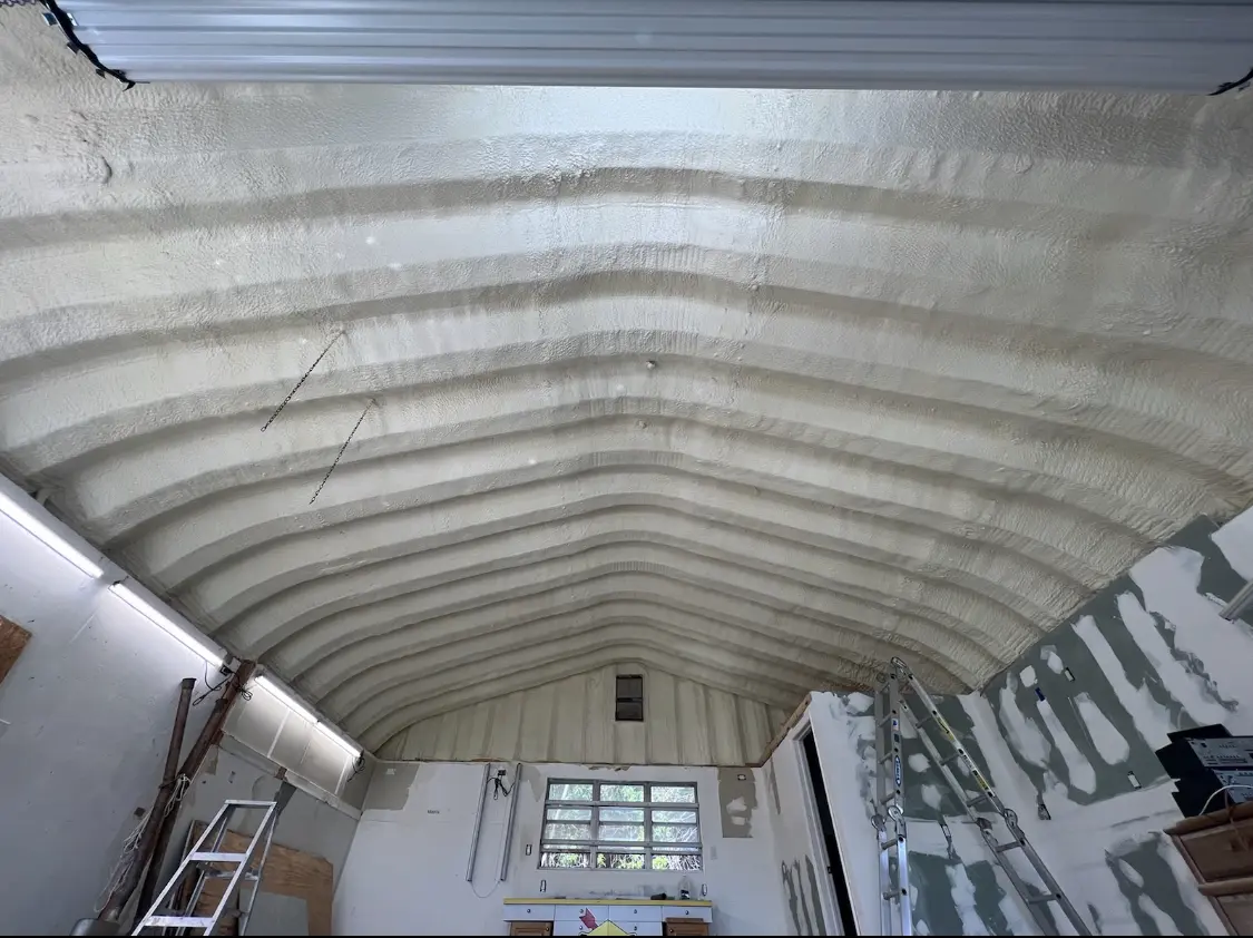 Spray polyurethane foam applied to the underside of a metal roof deck in Sylvania